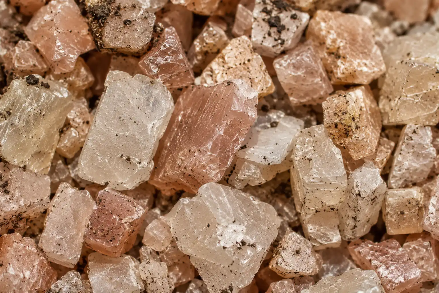 Langbeinite is a naturally mined crystalline salt of angular tan and pink granules, and it is the single mineral sold as 0-0-22 fertilizer